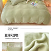 A set of cozy milk velvet bedding including a duvet cover and pillowcases with a pink stuffed animal.