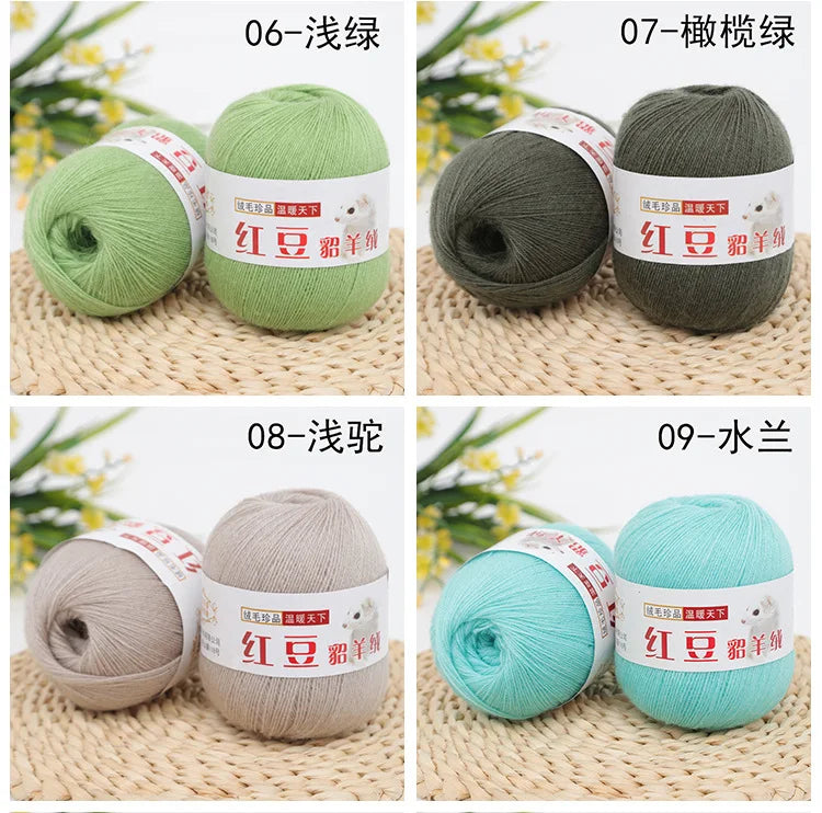 A set of fine yarn in various shades of green and gray, including solid and variegated colors, for knitting and crochet proje