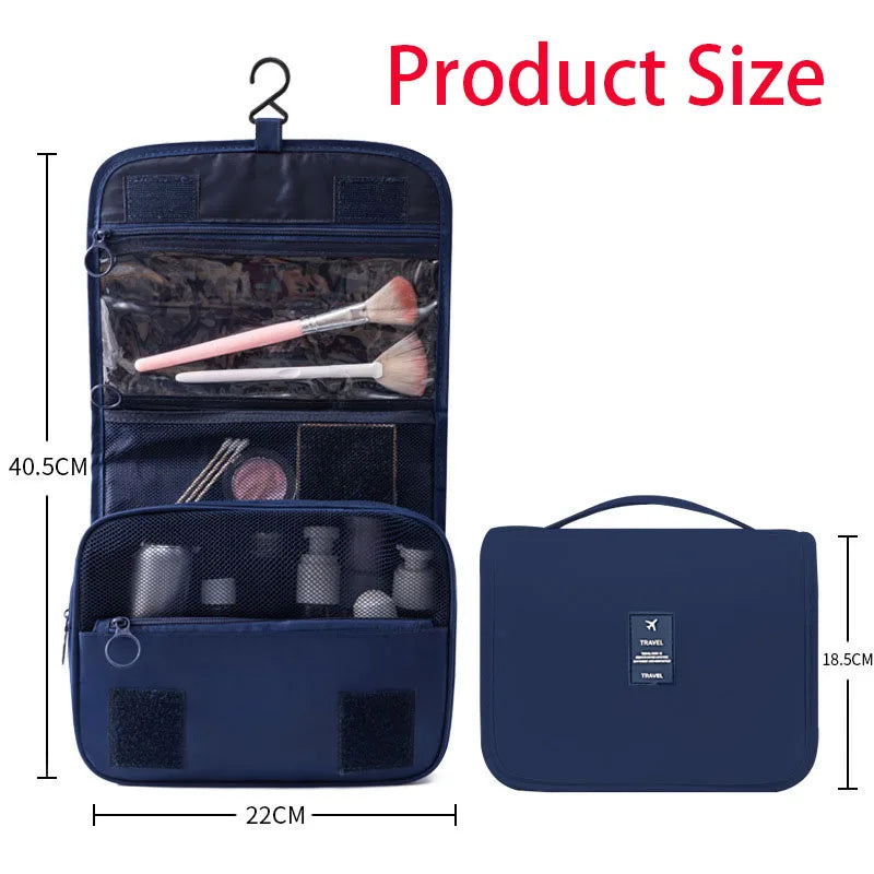A dark blue travel makeup bag with a hanging hook, showing an open compartment containing makeup brushes and a separate zippe