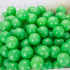 A large pack of bright green plastic ball pit balls for toddlers and kids