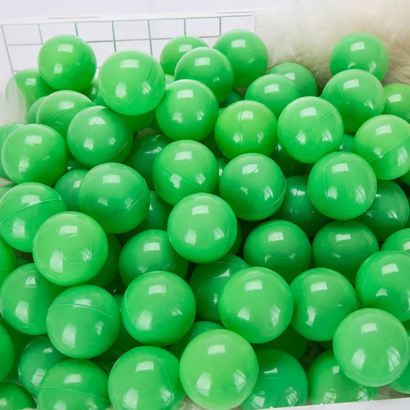 A large pack of bright green plastic ball pit balls for toddlers and kids