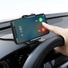 A hand places a smartphone onto a black car interior mount for hands-free viewing.