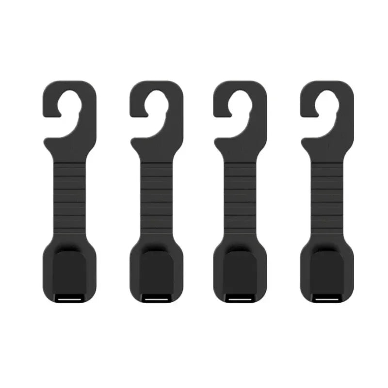 A pair of black universal car headrest hooks used as storage hangers for bags and clothes.