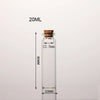 A clear glass bottle with a cork stopper, labeled 20ML, shown vertically.