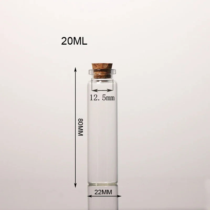 A clear glass bottle with a cork stopper, labeled 20ML, shown vertically.