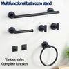 A black multifunctional bathroom stand featuring a towel bar and a ring hook mounted on a white wall.