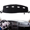 Black custom-fit dash cover for a Dodge Ram truck interior.