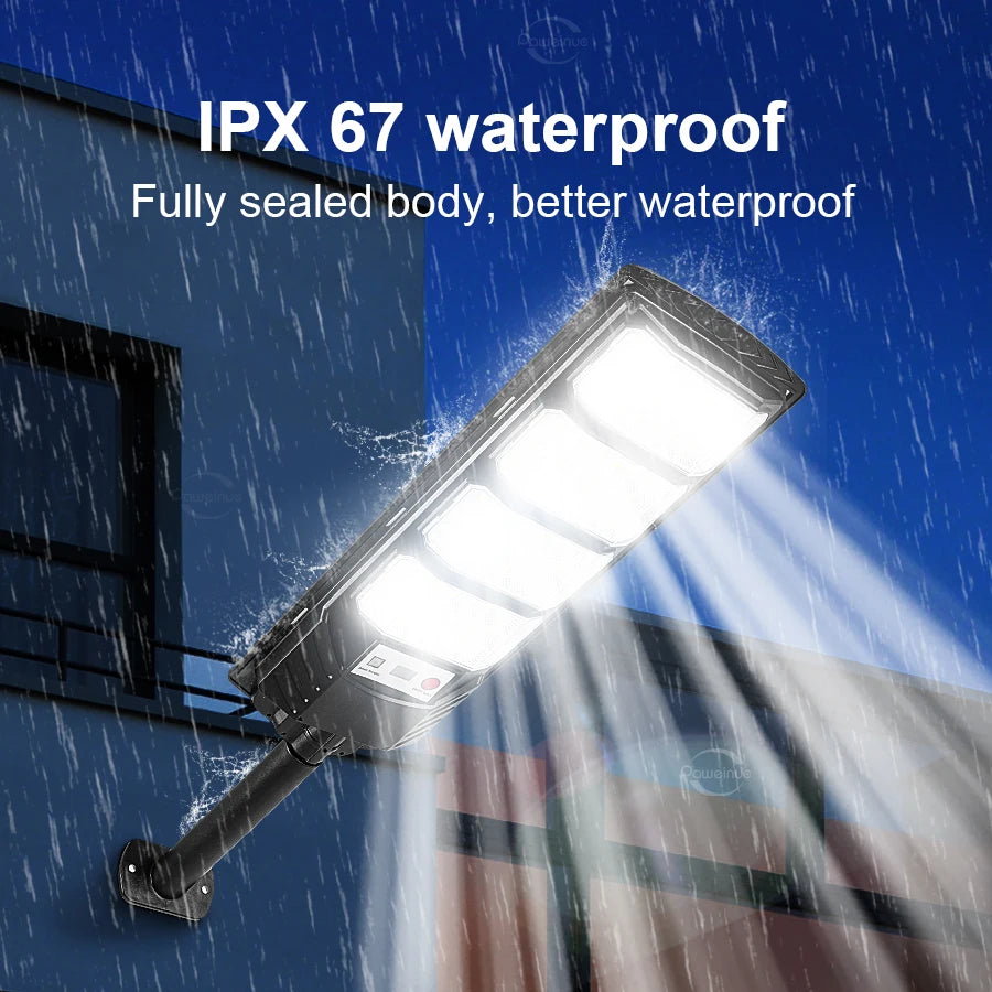 An IPX 67 waterproof solar wall light illuminating a building facade during rain.