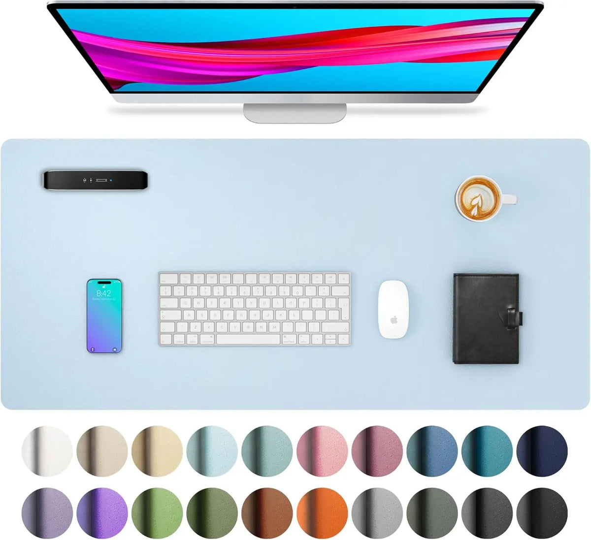 A computer monitor is displayed above a light blue desk pad featuring a keyboard, mouse, smartphone, and various colored circ