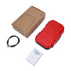 A red portable 4-digit combination safe lock box is shown with its cardboard packaging and a steel cable.