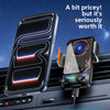 A black smartphone is shown mounted in a car vent using a bracket for wireless charging.