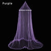 A sheer purple lace canopy mosquito net draped in a conical shape.