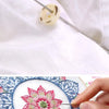 A set of self-threading sewing needles is shown being used for embroidery and sewing projects.