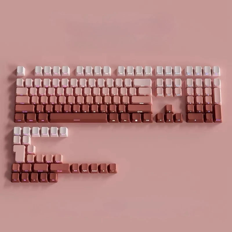 Nahaufnahme von pinken PBT-Tastenkappen-Gradienten für eine mechanische Tastatur, angeordnet in Reihen und Clustern.