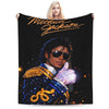 A graphic throw blanket featuring a portrait of Michael Jackson and a blonde woman above him.