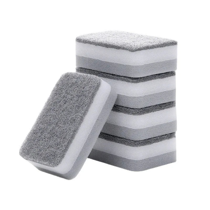 A stack of gray and white double-sided cleaning sponges or scouring pads.