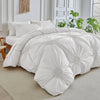 White three-dimensional pleated floral duvet cover set displayed on a bed.