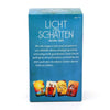 A box of the Licht und Schatten Tarot deck with a guidebook, featuring colorful tarot cards.