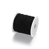 Black stretchy rainbow elastic cord wound on a white spool
