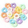 A collection of colorful acrylic spacer beads in a wave pattern, including pink, yellow, purple, and blue shades.