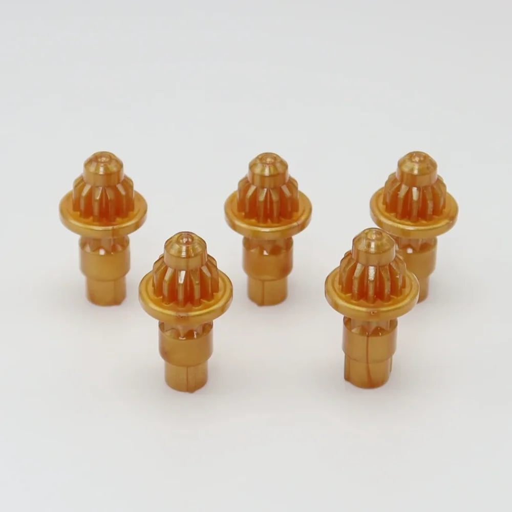 A set of five brass replacement drivers for a Takara Tomy battling top, displayed on a white background.