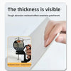 A hand holds a white tile sticker, demonstrating the seamless patchwork effect and visible thickness of the product.