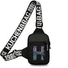 Black canvas chest bag with a wide strap featuring the text KUCHEN&BAG.1980