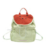A light green nylon messenger bag shaped like a watermelon with an orange rind and black seeds.