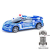 A blue police car toy with lights and sounds, shown next to its battery pack.