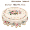 A round polyester tablecloth with a vintage floral pattern featuring pink, peach, and blue flowers.