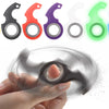 A hand is holding a metal fidget spinner keychain with various colored spinners, showing the spinning motion.