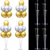 A set of clear plastic balloon column stands for party decor in gold and silver colors.