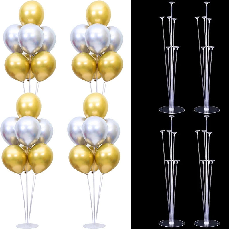 A set of clear plastic balloon column stands for party decor in gold and silver colors.
