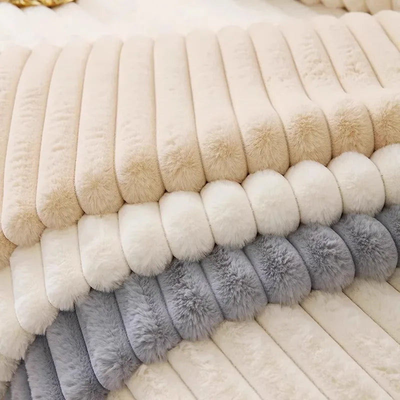 A close-up of a cozy plush anti-slip sofa cushion mat featuring horizontal stripes in cream, beige, and gray faux fur.