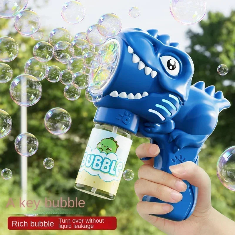 A hand holds a blue dinosaur bubble gun with lights, shown against a green outdoor background.
