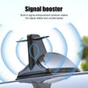 A black shark fin car antenna with a built-in signal booster is shown mounted on a vehicle.