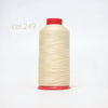 A spool of light beige heavy-duty nylon bonded thread with a red cap.
