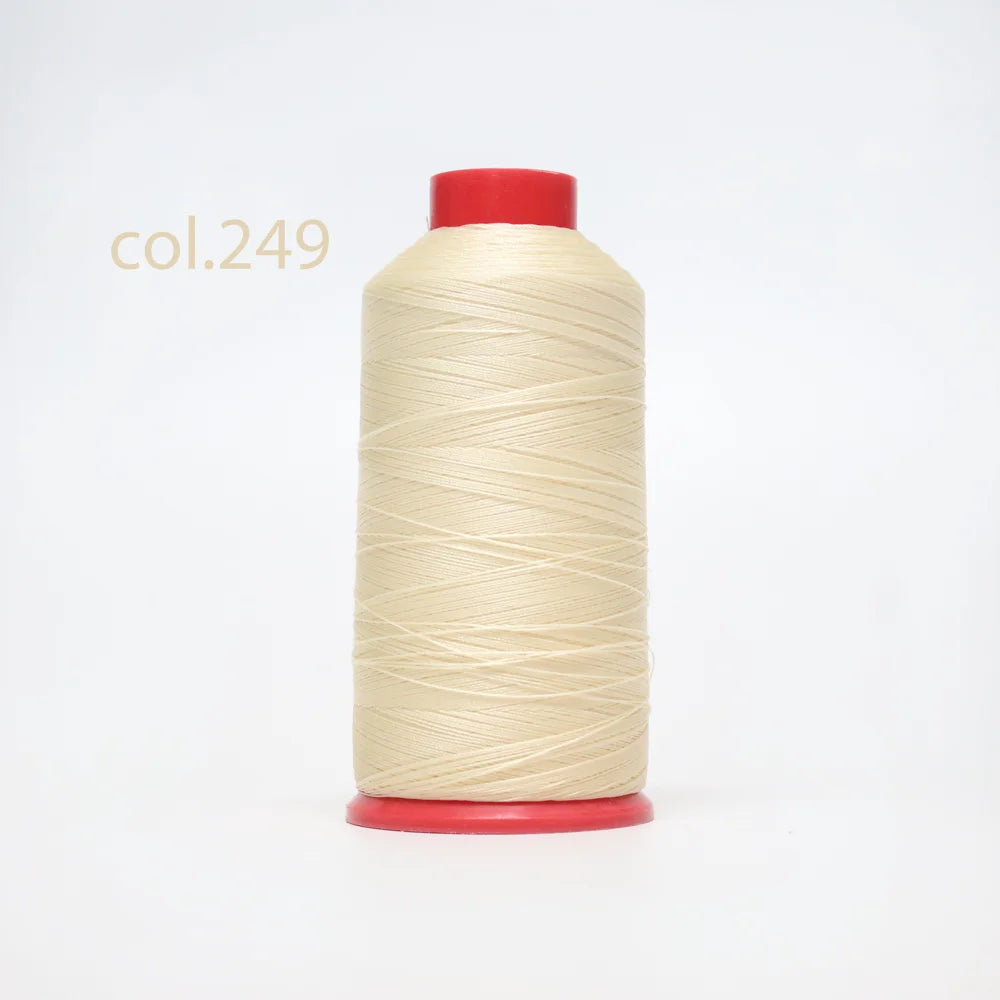 A spool of light beige heavy-duty nylon bonded thread with a red cap.