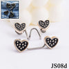 Silver heart-shaped buttons with black studs used for non-sew adjustable waist tighteners on denim fabric.