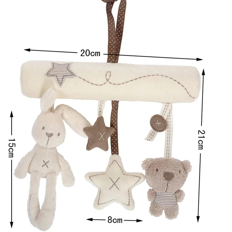 A soft plush bunny rattle toy hanging with a star and a teddy bear, suitable for a stroller or crib.