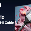 A silver USB-C to HDMI cable is shown against a colorful, abstract background.