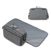 A gray compact stroller diaper bag organizer featuring a changing mat and storage compartments.