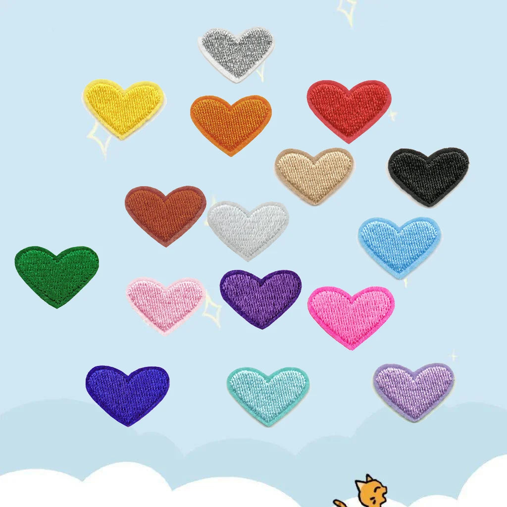 Assorted heart embroidered iron-on patches in various colors like yellow, orange, red, green, purple, and blue.