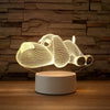 A glowing wireframe 3D illusion LED night light lamp shaped like a rhinoceros resting on a wooden surface.