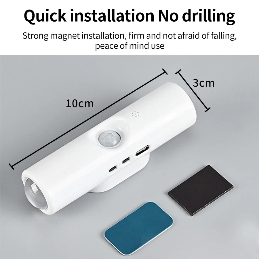 A white rechargeable LED motion sensor night light with an RGB color panel and a dark mounting plate.