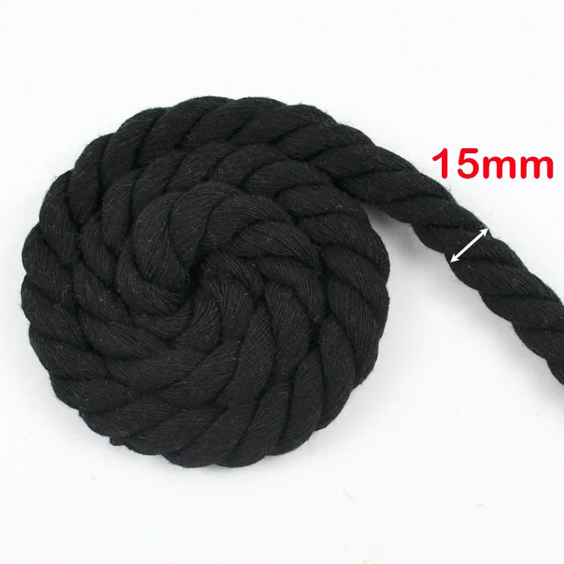 A ball of black natural twisted cotton cord with a 15mm thickness.
