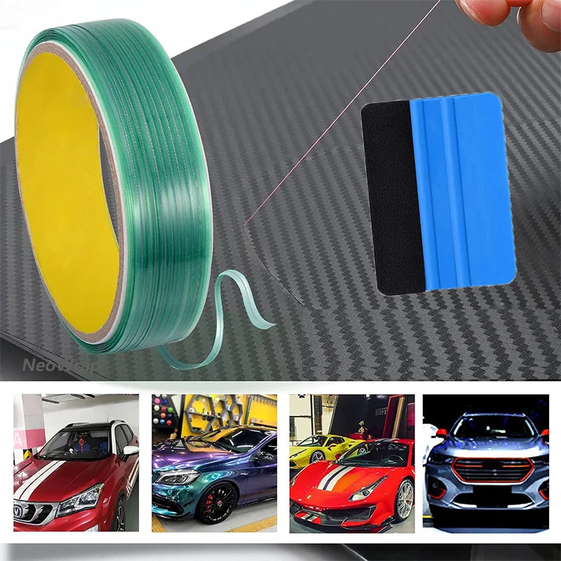 A professional vinyl wrap and window tint tool kit featuring a green roll of film and a blue applicator tool on a textured su
