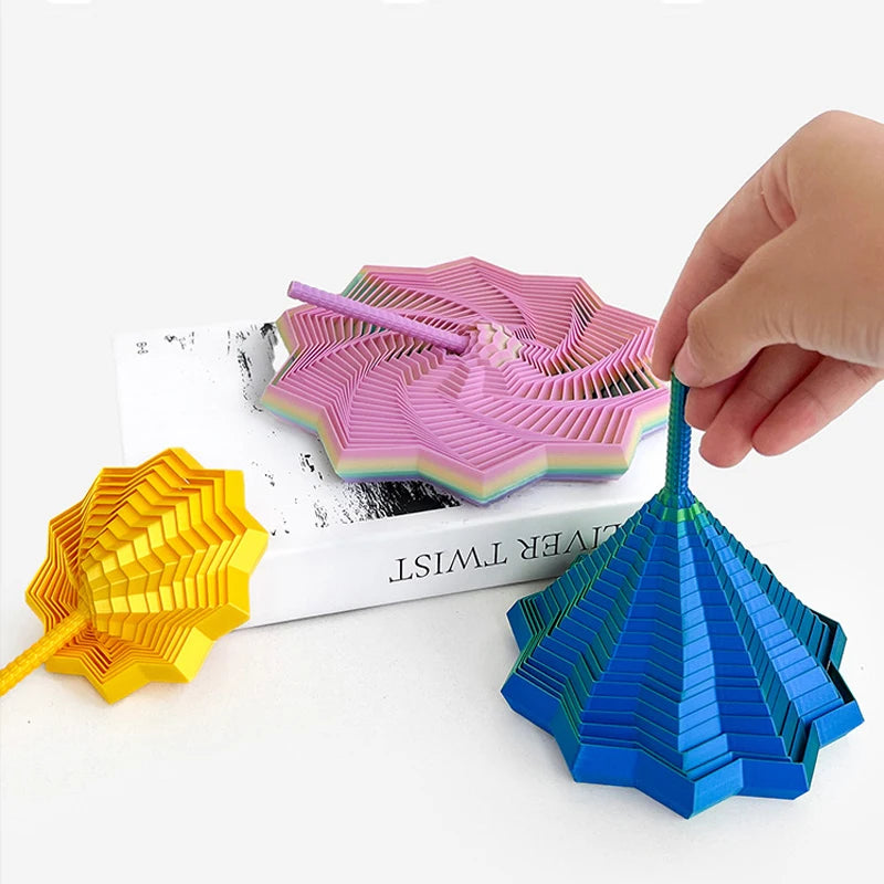 Hand holding a purple 3D illusion fidget star toy with various colored spiral patterns.
