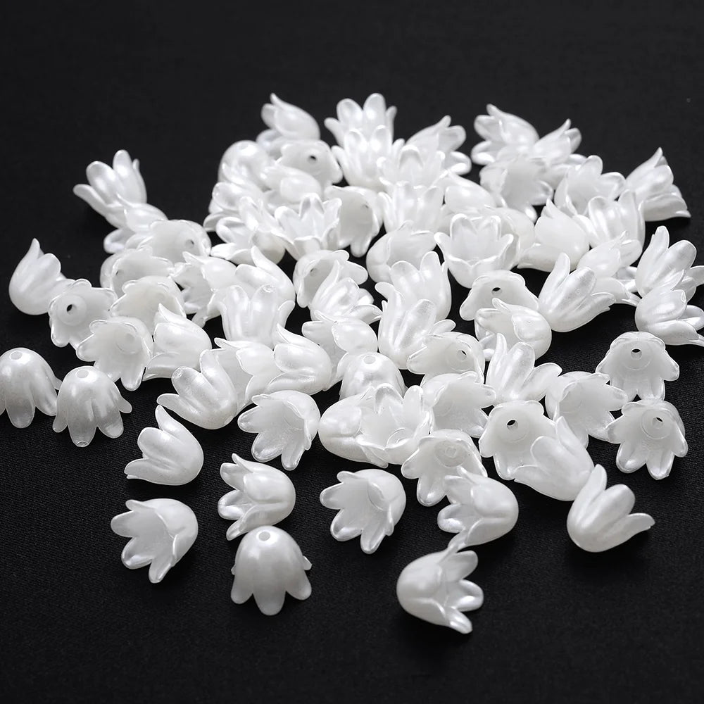 A pile of 100 white acrylic pearl spacer beads for jewelry making