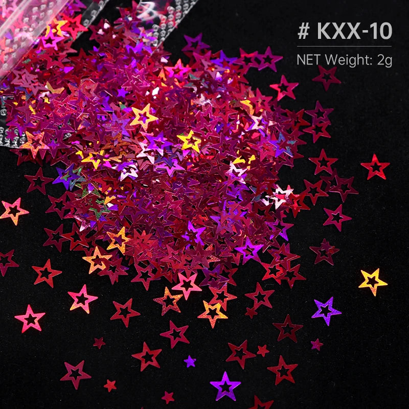 A pile of shiny holographic star sequins in various colors like pink, purple, and yellow on a black background.